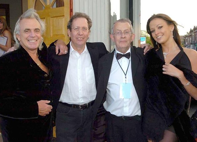 Sheffield born clubbing legend Peter Stringfellow with girlfriend Bella Wright outside the Abbeydale Picture house, Abbeydale Road, Sheffield, with development officer Barry Northall and chair of the Abbeydale Picture Trust, Mike Trott, second left, June 2005.