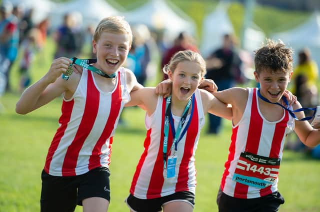Big smiles for these three youngsters during the junior race. Photo: Peter Langdown