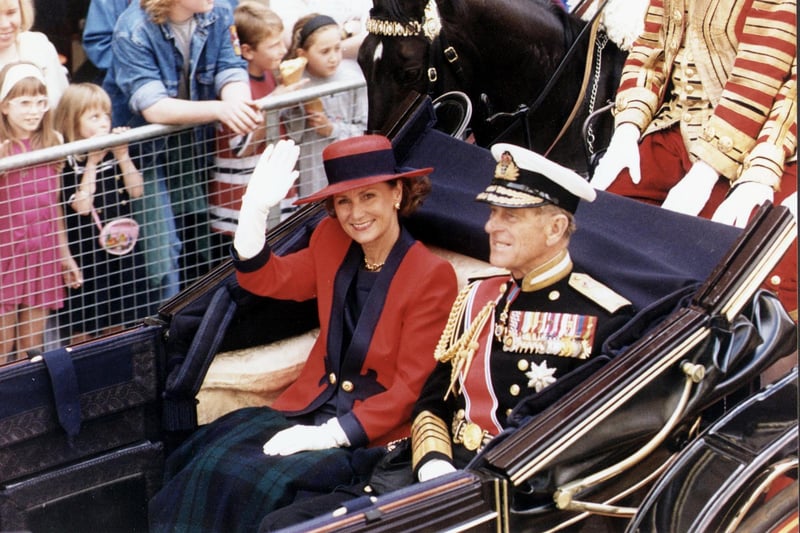 The State Visit of King Harald of Norway to Edinburgh in July 1994 - Queen Sonja waves to the crowds from a Royal coach. Also in picture, Prince Philip Duke of Edinburgh.