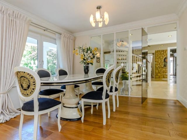 No wonder the temptation is to dine in every night! This delightful room is formal but also convivial, and leads to the well-appointed kitchen.