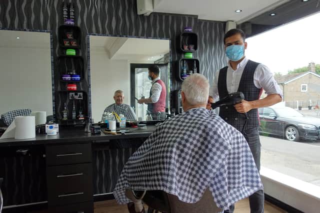 Barber Shwan Hama and customer Ian Cosford at Allen's Classic Barbers which opened on Saturday at Bents Green.