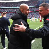 Sheffield United manager Paul Heckingbottom with Pep Guardiola of Manchester City: Darren Staples / Sportimage
