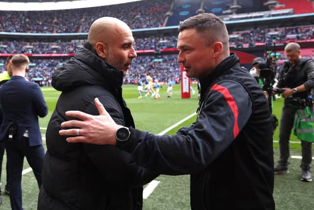 Sheffield United manager Paul Heckingbottom with Pep Guardiola of Manchester City: Darren Staples / Sportimage