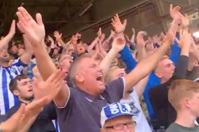 Sheffield Wednesday fans belt out a chant at Charlton Athletic.