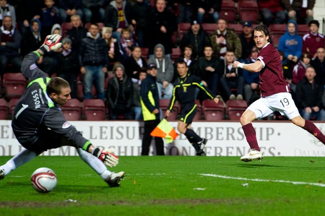Rudi Skacel set Hearts on the way to three points under Paulo Sergio. Eggert Jonsson won the game in the final 15 minutes.