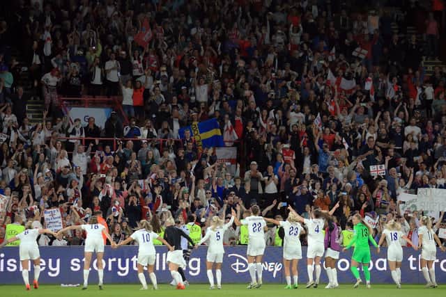England's teammates celebrate with fans after winning at the end of the UEFA Women's Euro 2022 semi-final football match between England and Sweden at the Bramall Lane stadium, in  Sheffield, on July 26, 2022. - England won 4 - 0 against Sweden. - No use as moving pictures or quasi-video streaming. 
Photos must therefore be posted with an interval of at least 20 seconds. (Photo by Lindsey Parnaby / AFP) / No use as moving pictures or quasi-video streaming. 
Photos must therefore be posted with an interval of at least 20 seconds. (Photo by LINDSEY PARNABY/AFP via Getty Images)