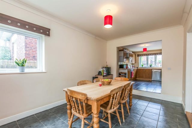 This dining area, just off the kitchen (background), boasts a ceramic tiled floor, coving to the ceiling and double-glazed window. There is ample space for a bigger dining table.