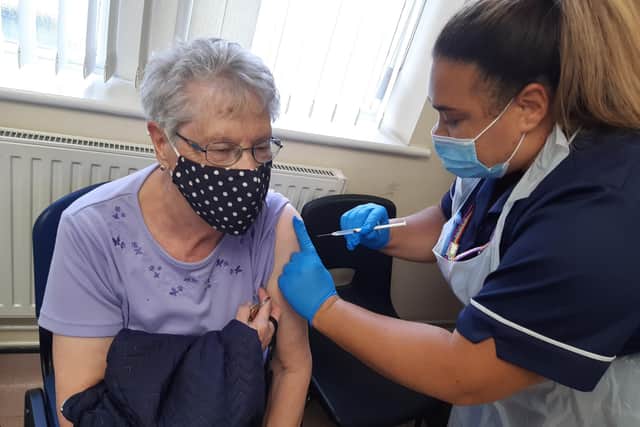 A patient receives her Covid autumn booster jab at Firth Park Surgery, Sheffield. Vaccinations are underway across the city this week