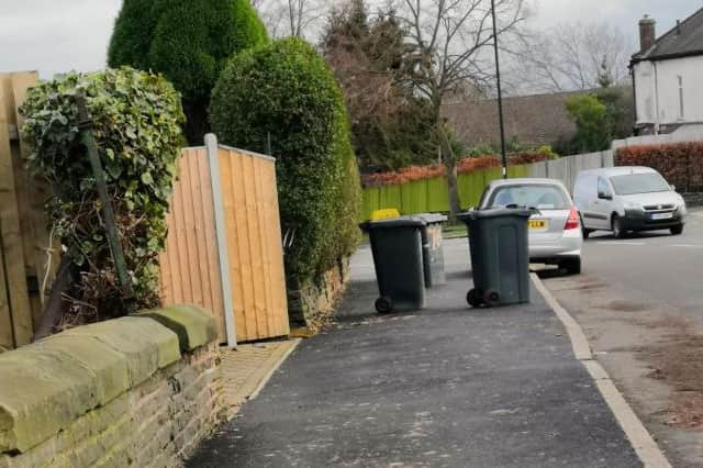 Emptied bins blocking the pavement in Sheffield