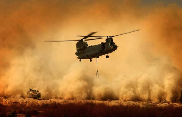 A Royal Air Force CH47 Chinook Helicopter re-supplying a patrol base in Helmand Province, Afghanistan. Tuesday December 15, 2009. The Ministry of Defence has announced plans to buy 22 new Chinook helicopters to increase air support on the frontline in Afghanistan. See PA story POLITICS Defence. Photo credit should read: Sean Clee/MoD/PA Wire