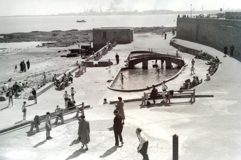 A 1954 summer view of the paddling pool and the North Steel Works across the bay. Photo: Hartlepool Museum Service.