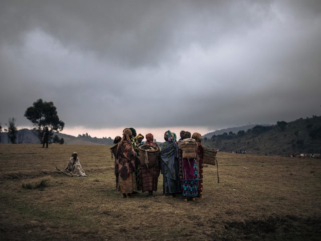 Displaced women gather for a discussion on recent kidnappings and sexual assaults committed by armed men around the internally displaced persons camp of Bijombo.