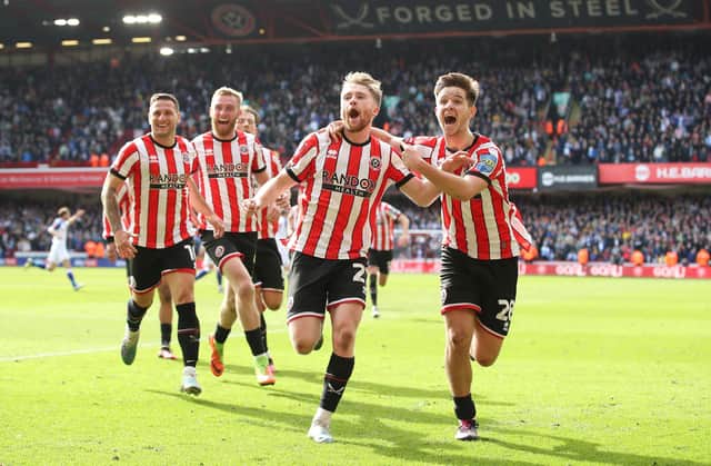 Tommy Doyle of Sheffield United celebrates with teammates, including James McAtee (right) after firing the club to Wembley: Jan Kruger/Getty Images