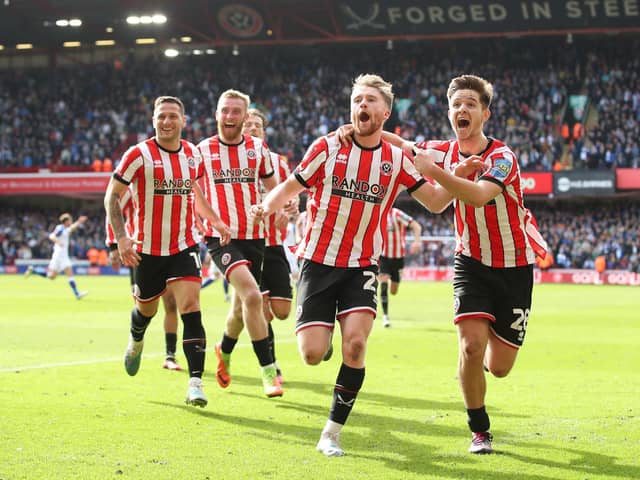 Tommy Doyle of Sheffield United celebrates with teammates, including James McAtee (right) after firing the club to Wembley: Jan Kruger/Getty Images
