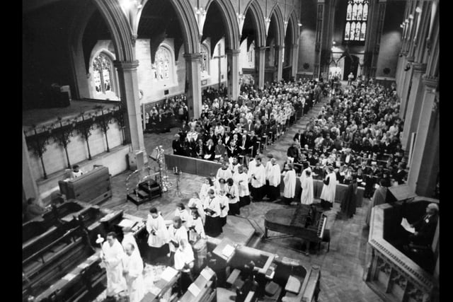 St Mary's Church Fratton Portsmouth .The church choir performs at The News Christmas carol service 5th December 1993