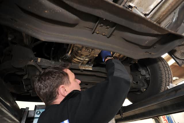 Catalytic converter thefts are on the rise in Sheffield. File picture posed by a police officer