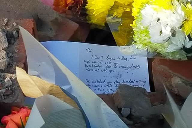 A card left at the scene. A loved one wrote: "I can't begin to say how much we will miss you.."