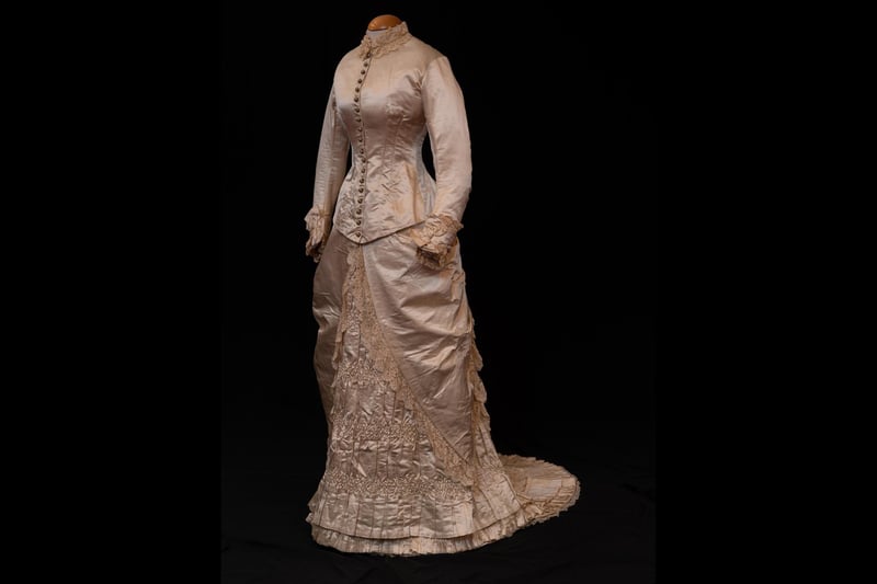 This wedding dress would have been the talk of the town when worn by Agnes Helen Gordon for her marriage to Donald MacDougall in June 1882. The couple ran a shop and following the death of her husband,  Mrs MacDougall continued in business and became a prominent figure in Grantown life.