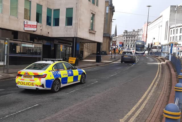 This is the scene on Commercial Street, Sheffield, this afternoon after a collision between a man on a scooter and a bus.