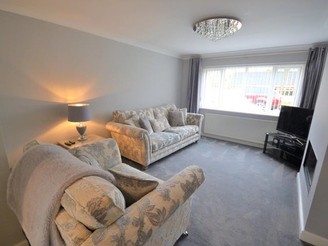 Sitting room/lounge -  A beautifully presented sitting room with Oak double glazed doors leading off from the dining room which can be opened when entertaining or shut when relaxing. Having an attractive living flame feature gas fire, various power sockets, t.v. aerial point, central heating radiator, coving complements the ceiling and upvc double glazed window provides a pleasant outlook.