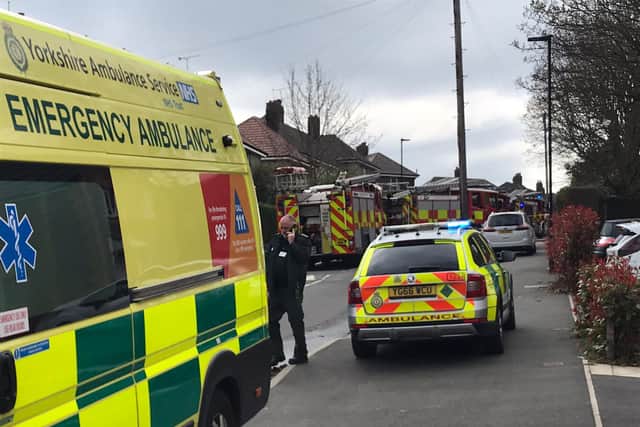 Paramedics and firefighters attend a house fire on Cradock Road in Arbourthorne, Sheffield, where a woman was rescued and taken to hospital