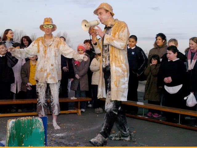 Hinde House Primary School joint headteacher Nick Thomas (right) and colleague Rachel Emery (left) are 'gunged' after pupils paid into the school's tsunami fund to witness the event