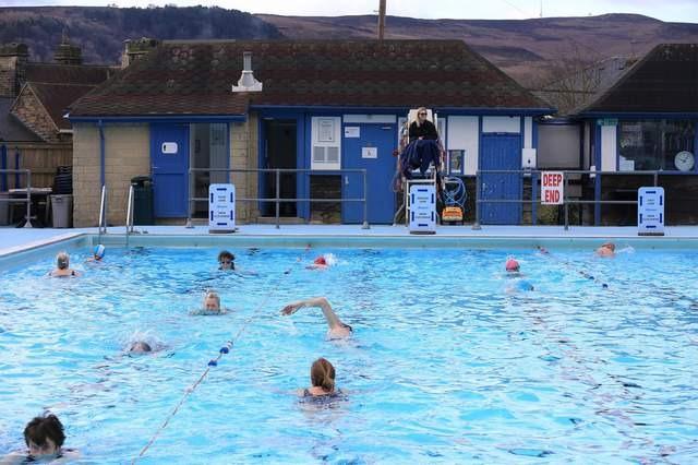 Hathersage Pool is an open air swimming pool – One of a dwindling number of such pools – With water heated to 82°F (28°c), with hot poolside showers, lawns and views of Stanage Edge, Hathersage Church and the surrounding hills - Perfect for a relaxing day off.