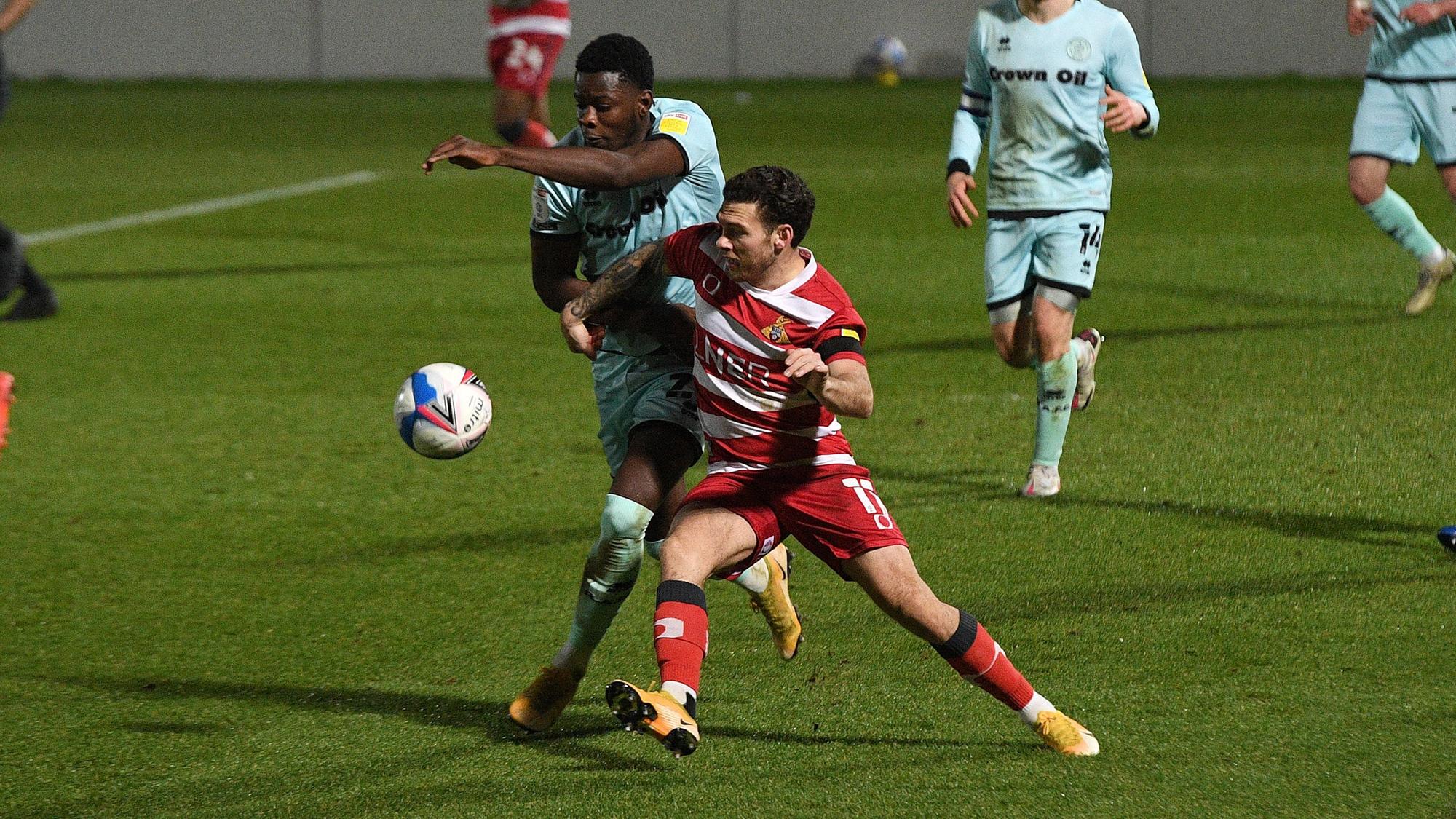 Jon Taylor tussles with Rochdale's Kwadwo Baah. Picture: Andrew Roe/AHPIX