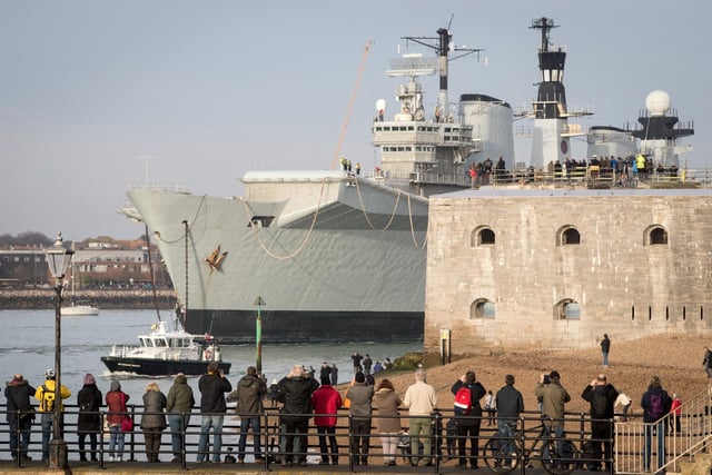 People watched as Britain's last serving aircraft carrier HMS Illustrious was towed from her home port at Portsmouth after being sold for scrap on December 7, 2016 in Portsmouth. 'Lusty' was to be broken up for scrap in Turkey despite attempts last minute attempts to save her. Photo by Matt Cardy/Getty Images