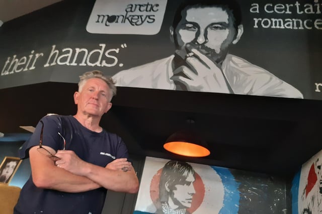 Artist Paul Staveley, in front of some of his work inside the new Indie Go bar Sheffield, on Eldon Street, formerly home to the Devonshire Cat