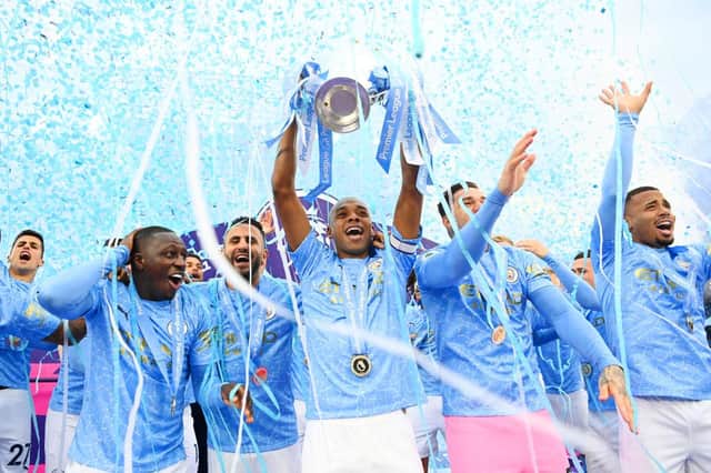 Fernandinho of Manchester City lifts the Premier League Trophy. (Photo by Michael Regan/Getty Images)