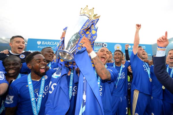 LEICESTER, ENGLAND - MAY 07:  Danny Simpson of Leicester City lifts the Premier League Trophy as players celebrate the season champions after the Barclays Premier League match between Leicester City and Everton at The King Power Stadium on May 7, 2016 in Leicester, United Kingdom.  (Photo by Michael Regan/Getty Images)