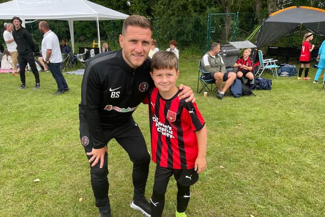 Billy Sharp with his eight-year-old son, Leo