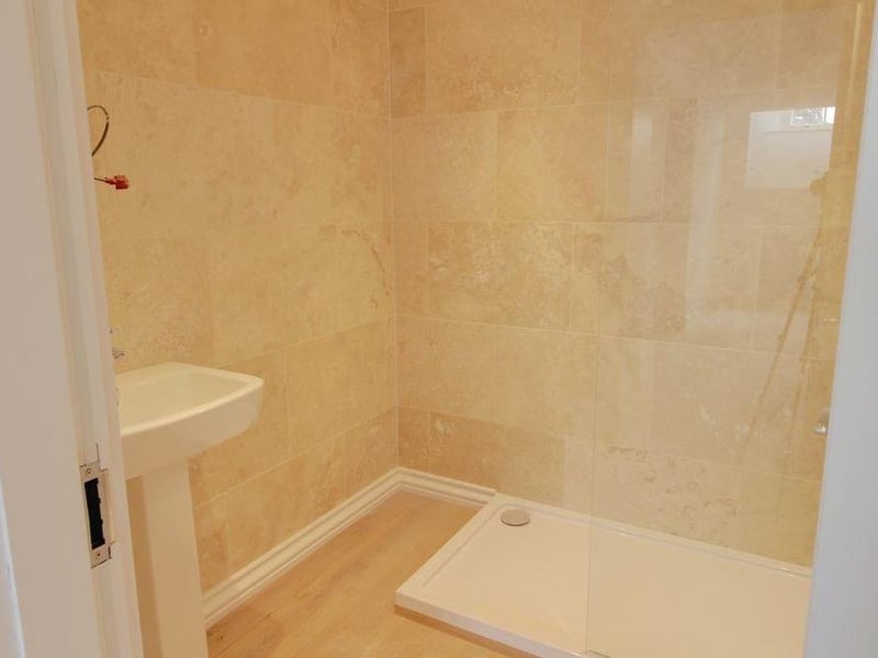 A well-decorated three-piece en suite adds to the appeal of the second bedroom. Its highlight is a walk-in shower.
