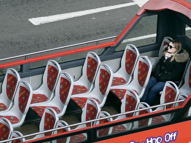 Edinburgh tour buses are still seeing the sights, but with very few takers. Picture: Lisa Ferguson