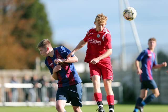Horndean (red) v US Portsmouth in the Under-18s Hampshire Combination East Division. Picture: Chris Moorhouse