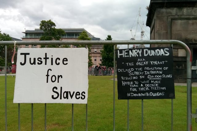 One of the placards pointed out that Henry Dundas was responsible for delaying the abolition of slavery, which forced hundreds of thousands of slaves to wait longer for their freedom.