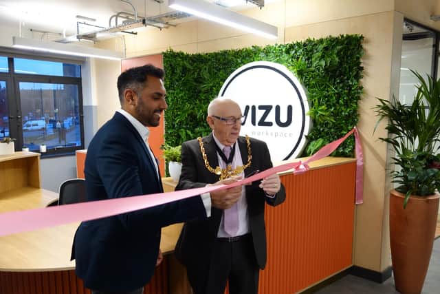 Lord Mayor Coun Tony Downing cuts the ribbon with Wizu chief executive Tom Almas.