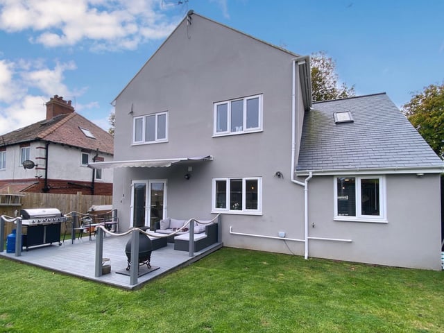 To the rear there is a lawn and beautiful decked patio area.