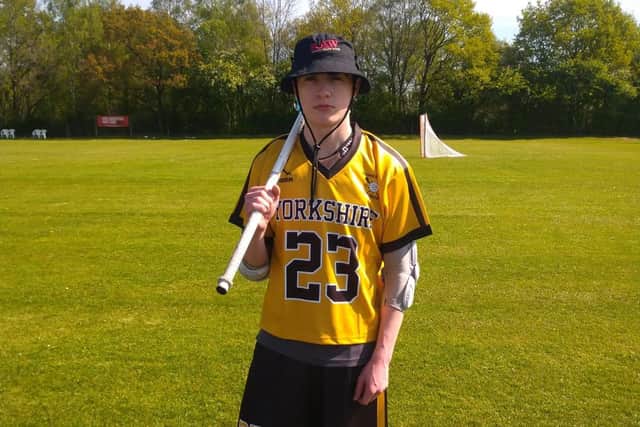 Charlie posing in Lacrosse gear. The family are aiming to raise $20,000 to cover the last of Charlie's college fees.