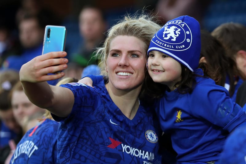 Millie Bright poses for a pic with a fan after the Barclays FA Women's Super League match between Chelsea and Reading at Kingsmeadow on January 05, 2020.