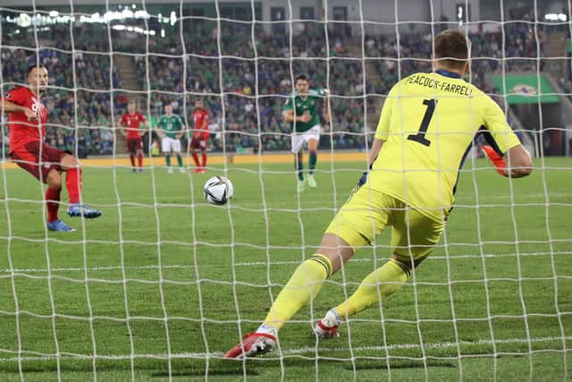 Northern Ireland's goalkeeper Bailey Peacock-Farrell saves a penalty taken by Switzerland's forward Haris Seferovic to make it three on the trot.