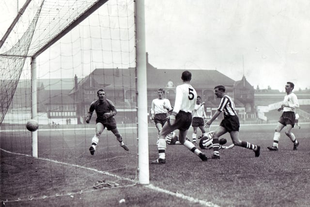 United entertain Bolton Wanderers at Bramall Lane - complete with the ground's old cricket pavilion - in October 1962.