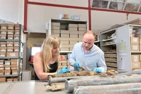 Archaeologist and Digging for Britain presenter Dr Cat Jarman with Dr Daniel Young from Wessex Archaeology examining the Sheffield Castle core samples at the Wessex Archaeology labs.