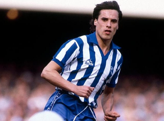 Claimed the Owls' second goal on 68 minutes to silence the Kop End and cap a famous victory for Wednesday. A midfielder with over 200 Owls appearances by the time he left for Oxford, Shelton played for Bristol City and Chester before retiring in 2000. Was a coach at West Brom for several years.