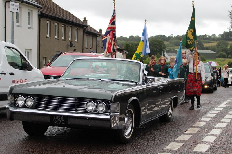 Tartan Queen elect Lexie Donald leads the procession in a fabulous 1965 Ford Lincoln.