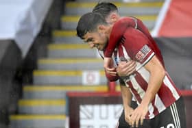 John Egan scored the winner for Sheffield United against Wolves (Photo by PETER POWELL/POOL/AFP via Getty Images)