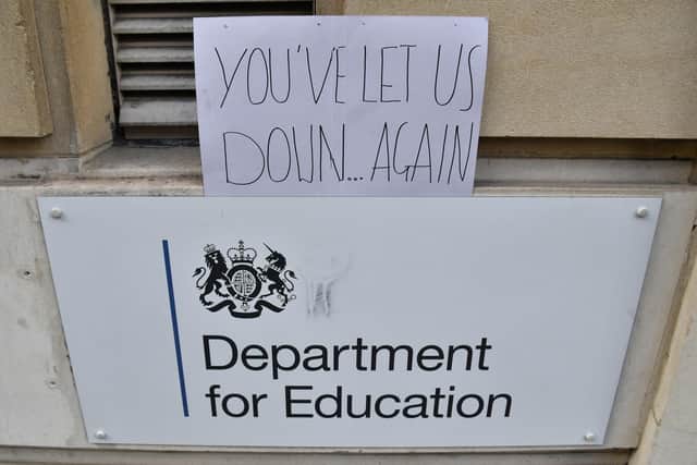 A sign left outside the Department for Education building in London, as a protest over the continuing issues of last week's A level results which saw some candidates receive lower-than-expected grades after their exams were cancelled as a result of coronavirus.