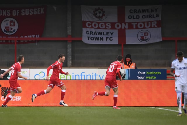 Jordan Tunnicliffe celebrates Crawley Town's third goal as the League Two side dumped out Premier League Leeds United.