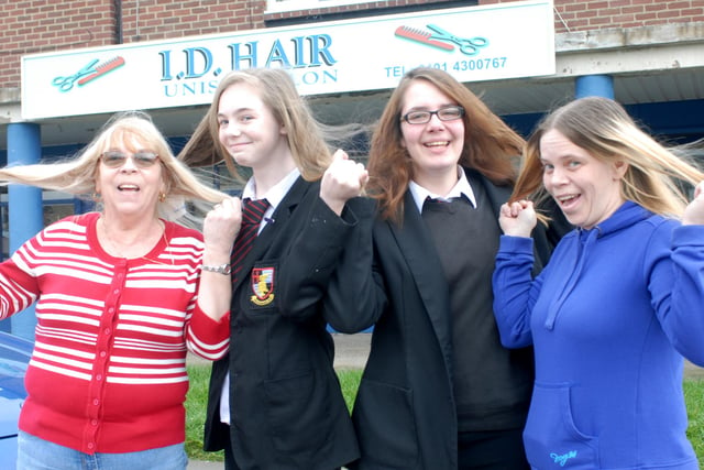 They were pictured before losing their hair for St Clare's Hospice in 2014. Pictured from the left are Steph Addison , Kaylegh Hubbert , Chloe Dodsworth and Sabrina Hubbert.